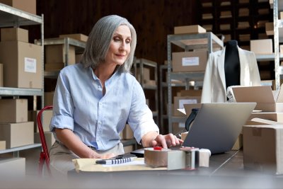 mature woman working on computer at business